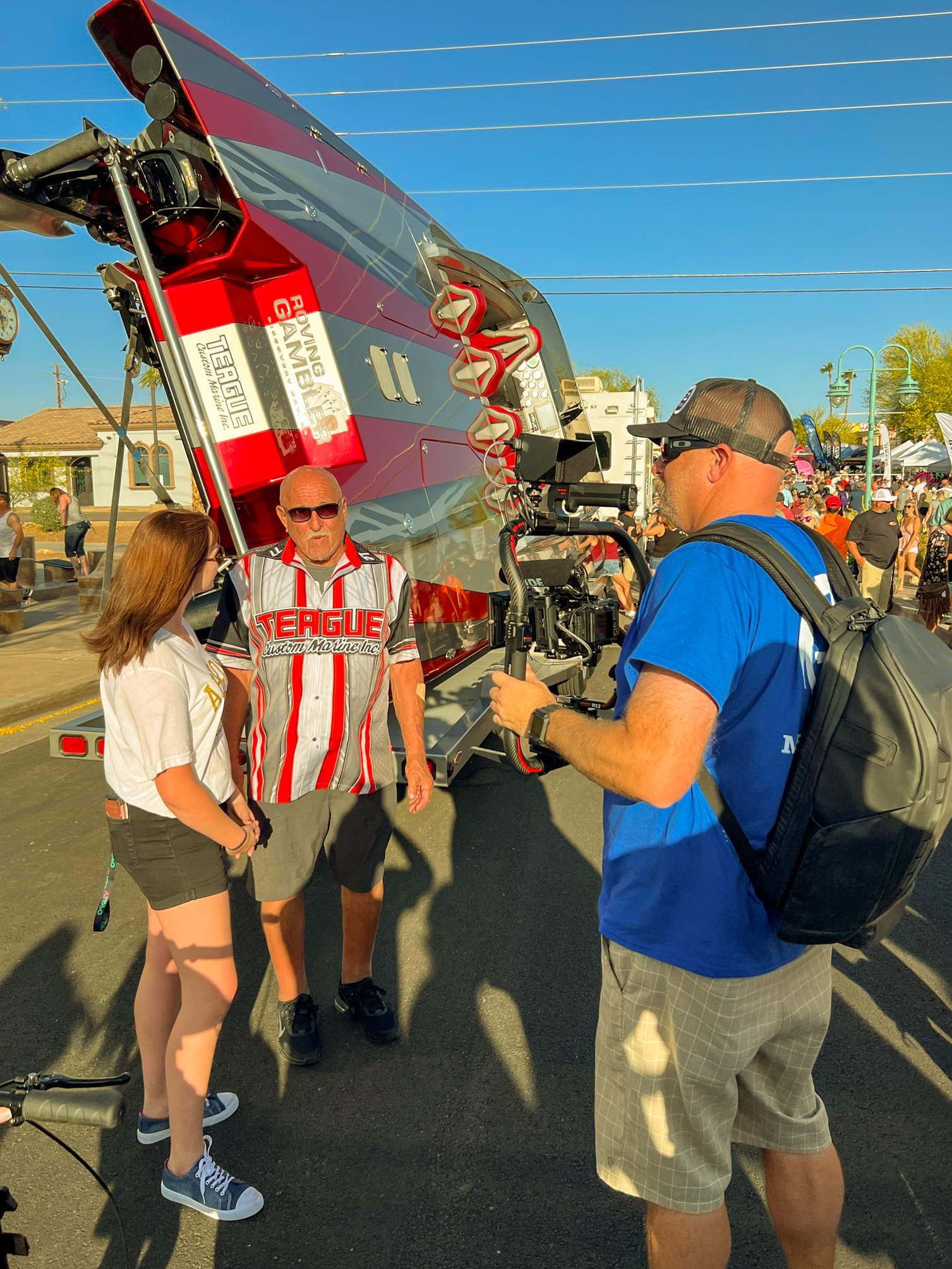 videographer filming interview next to high performance boat at Desert Storm event in Lake Havasu